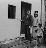 Mills painting his house